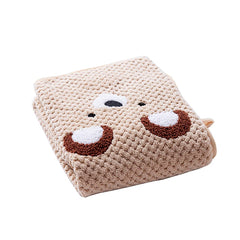 Soft beige plush pet towel with cute cartoon face. Shop trending pet essentials and get a free poop bag holder with purchase.