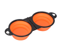 Orange collapsible pet bowls with black frame for travel and outdoor use