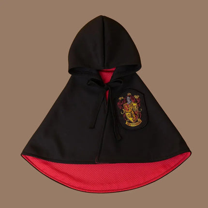 Black Magic Academy Cape for pets with red lining and Gryffindor-style crest.