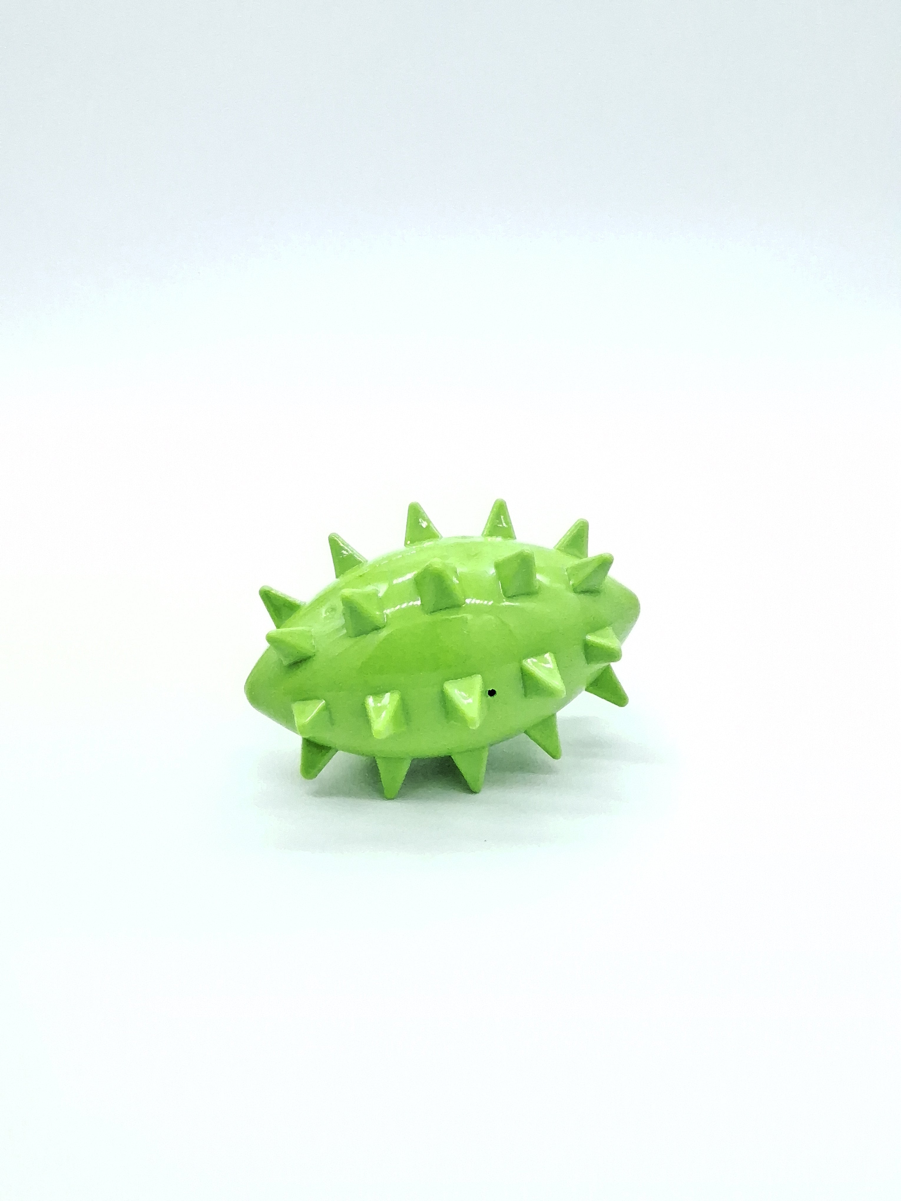 Green spiked pet toy for dogs and cats, durable and fun for playtime