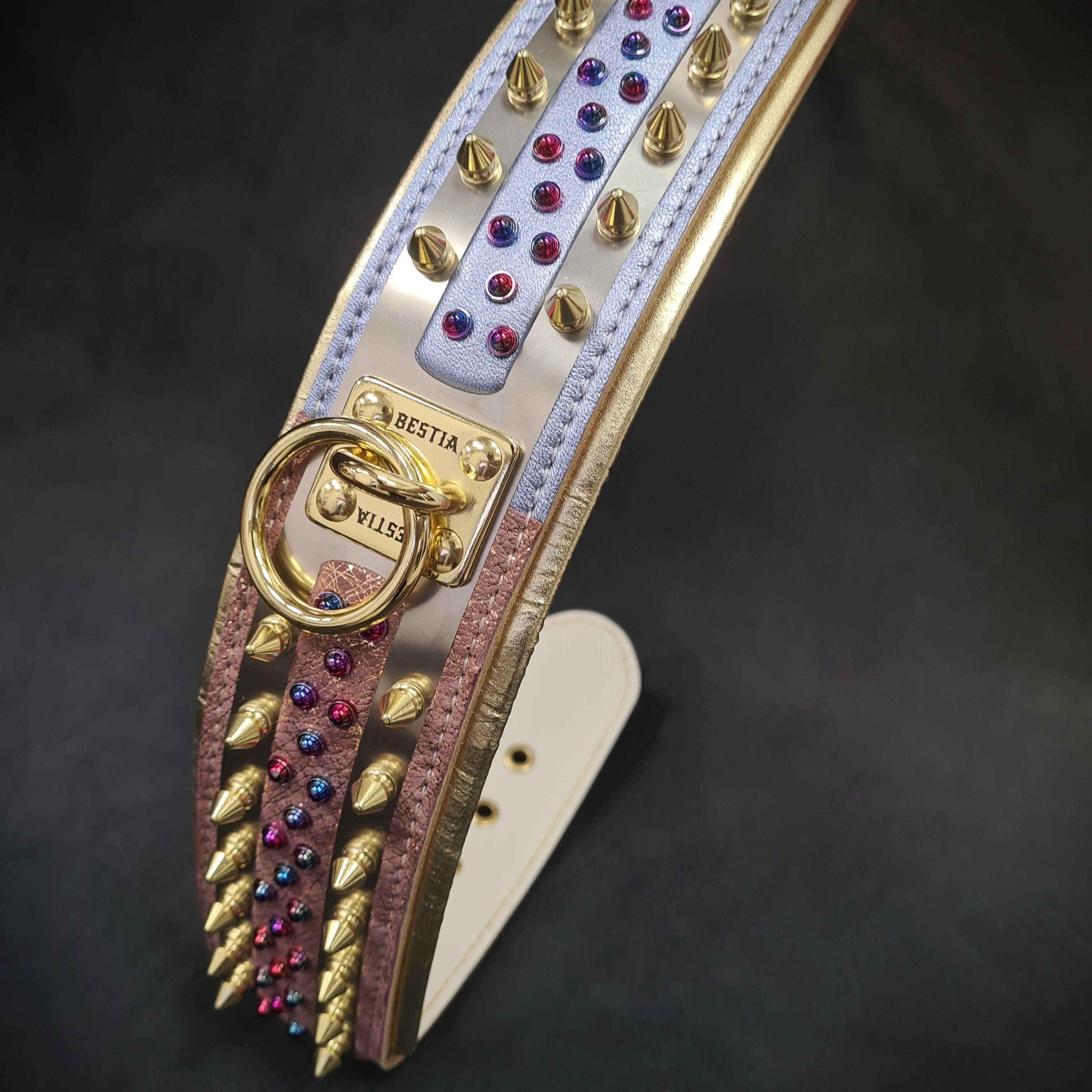 Luxury dog collar with gold spikes, colorful gems, and BESTIA branding, perfect for stylish pets.
