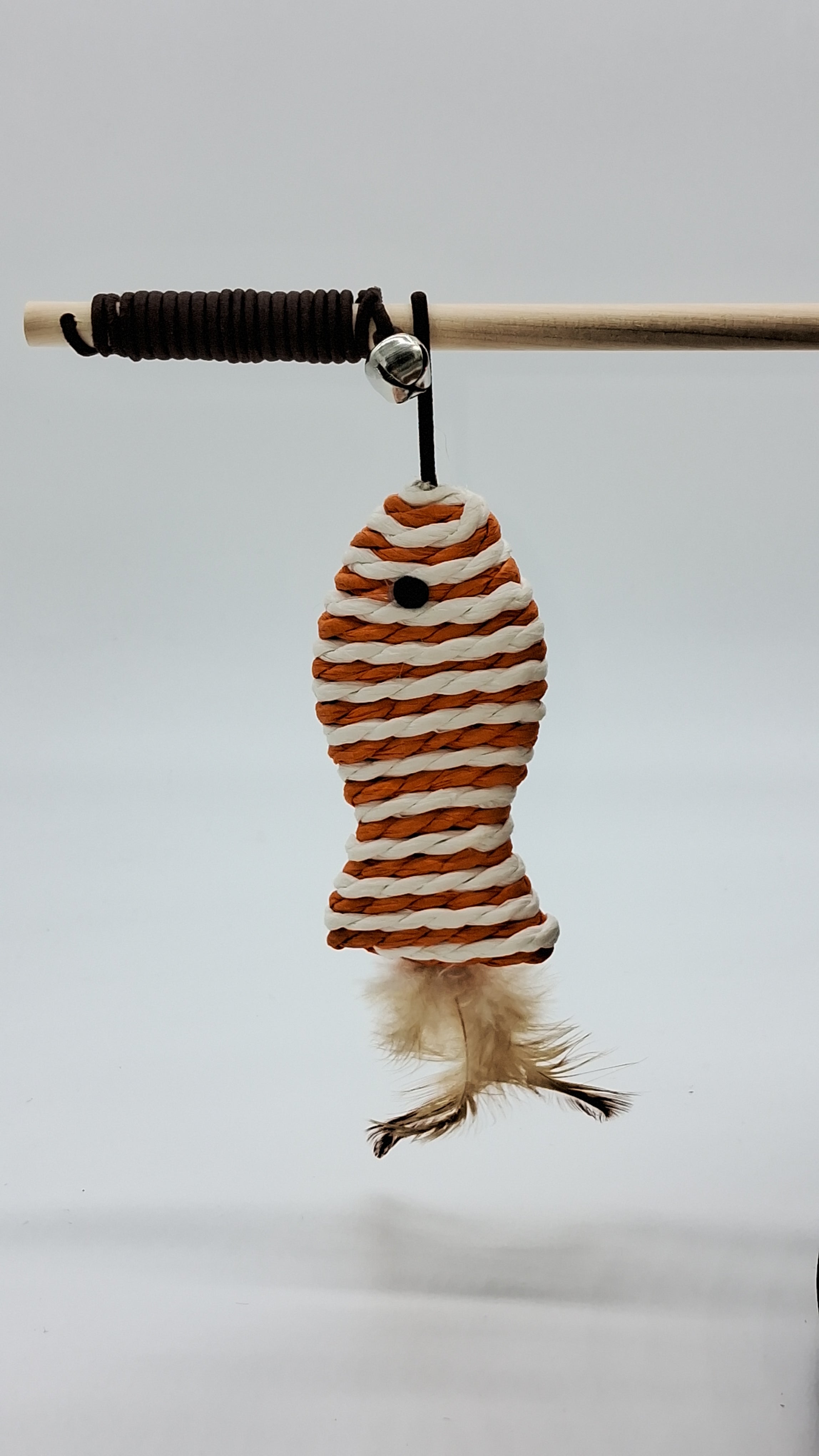 Cat wand toy with striped rope fish, feather tail, and bell for interactive play
