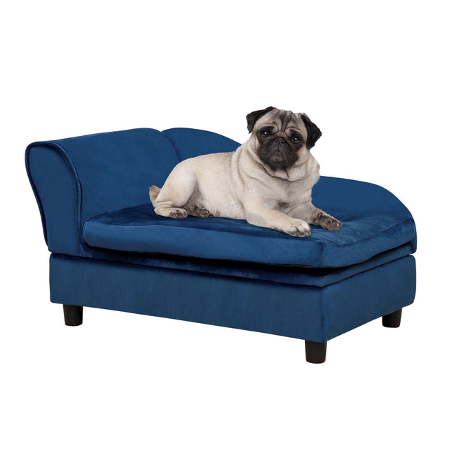 Pug resting on a plush blue velvet pet sofa bed, cozy dog lounge furniture for small dogs