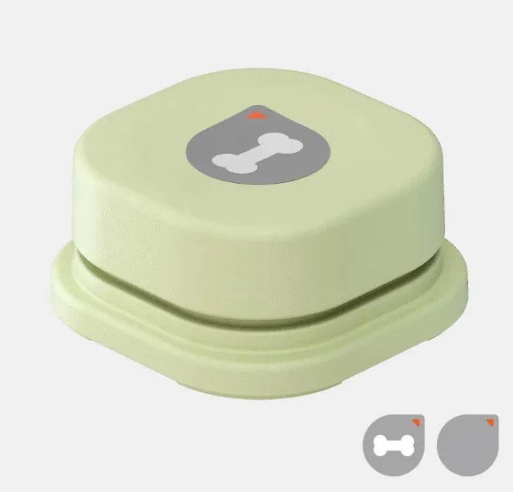 Pastel green pet training clicker with bone icon, ideal for dog and cat obedience training