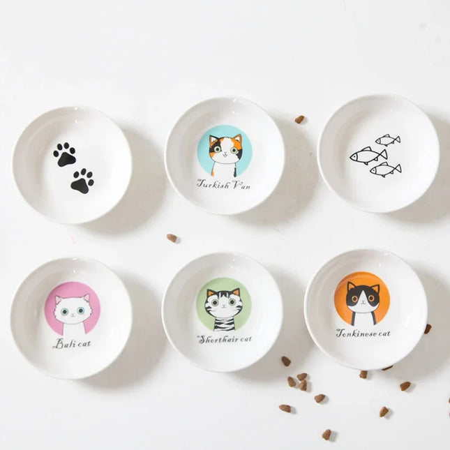 Cute cat-themed ceramic pet bowls with breed designs and paw prints, ideal for cat food or treats.