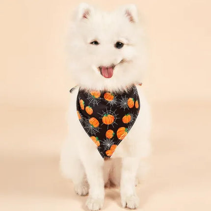 White fluffy dog wearing a Halloween pumpkin print double-sided bandana by Nai Pet Store