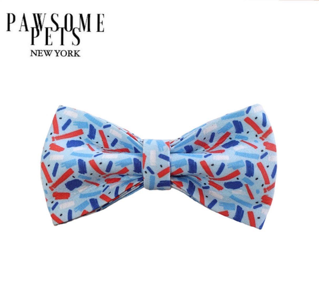 Blue pet bow tie with red and navy abstract pattern, stylish dog accessory for festive occasions