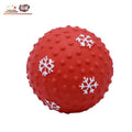Red textured dog chew toy ball with white snowflake patterns for pets