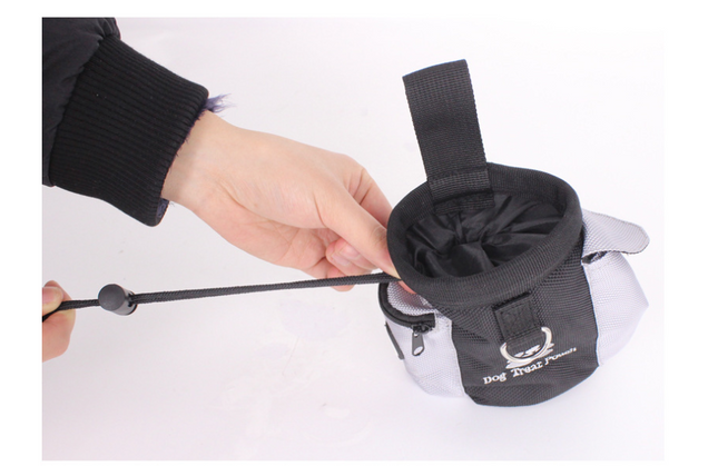 Black and gray dog treat pouch with adjustable strap, ideal for training sessions and pet care essentials.