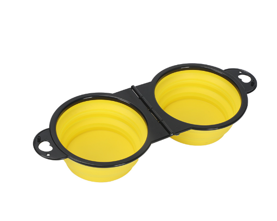 Yellow collapsible dual pet bowl for dogs and cats, portable travel feeder with black frame