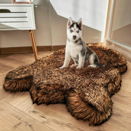 Husky puppy sitting on a brown IHAPPYDOG faux fur memory foam dog bed on a wooden floor