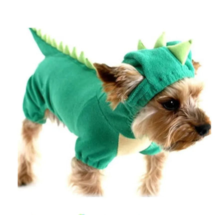 Small Yorkshire Terrier wearing a green dinosaur costume with spikes.