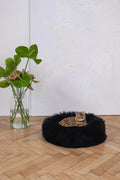 Fluffy black cat bed with Bengal cat resting, modern home decor, pet essentials for cozy comfort