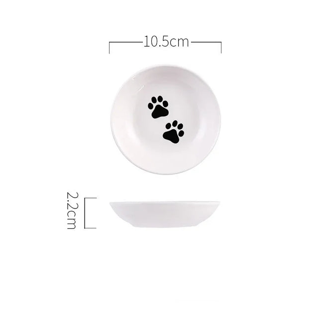 White ceramic pet bowl with black paw prints, 10.5cm diameter, ideal for dog or cat food and water