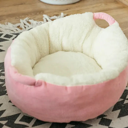 Pink plush pet nest bed with soft white fleece lining for cats and dogs.