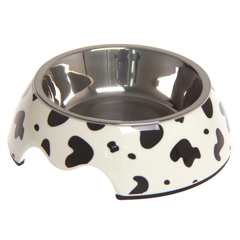 Stainless steel pet bowl with black and white cow print design, ideal for dogs and cats