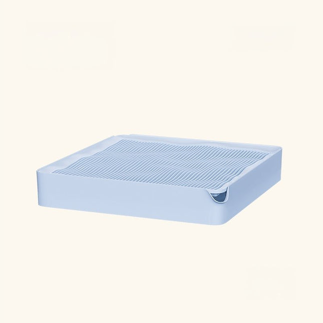 Light blue pet litter tray with ridged surface and corner scoop for easy cleaning