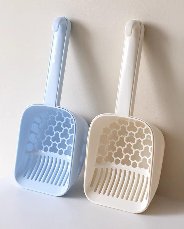 Blue and white cat litter scoops with honeycomb design for easy cleaning and pet care essentials