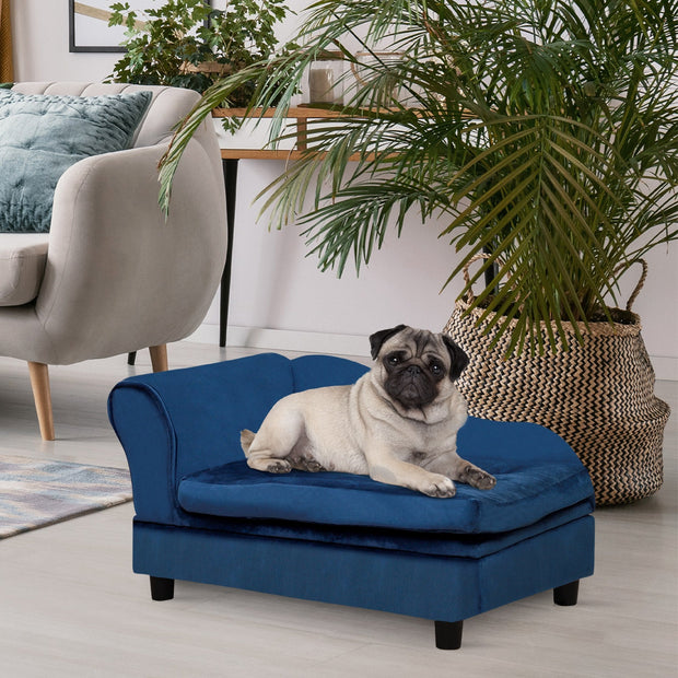 Pug resting on blue velvet dog bed in modern living room, cozy pet furniture for small dogs