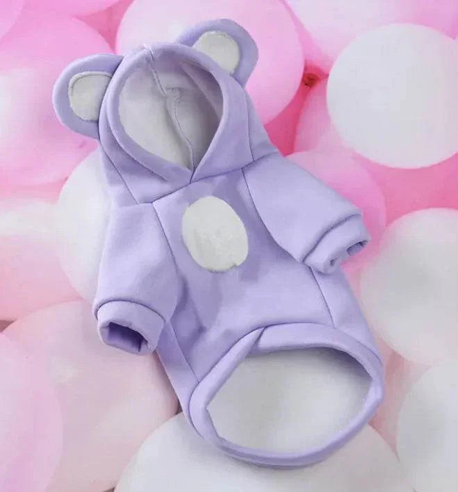 Purple bear-ear hoodie for small dogs or cats, cozy pet clothing with white accents on pink background