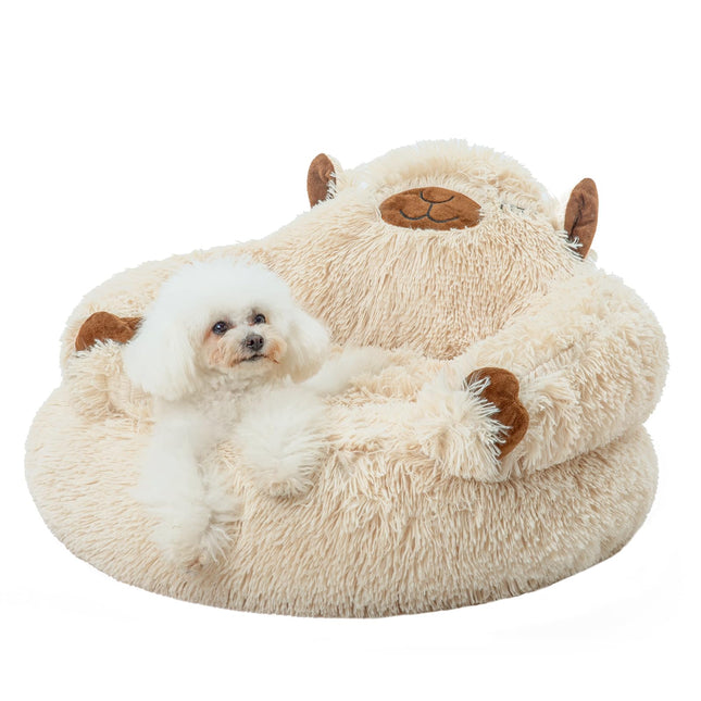 Fluffy dog bed shaped like a bear with small white dog resting inside, cozy pet accessory for dogs