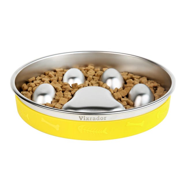 Yellow non-slip pet food bowl with stainless steel insert and dry kibble.